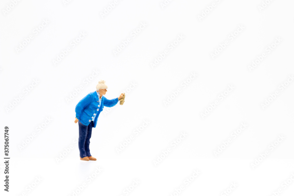 Miniature people standing on white background and copy space for your text Miniature people standing on white background and copy space for your text