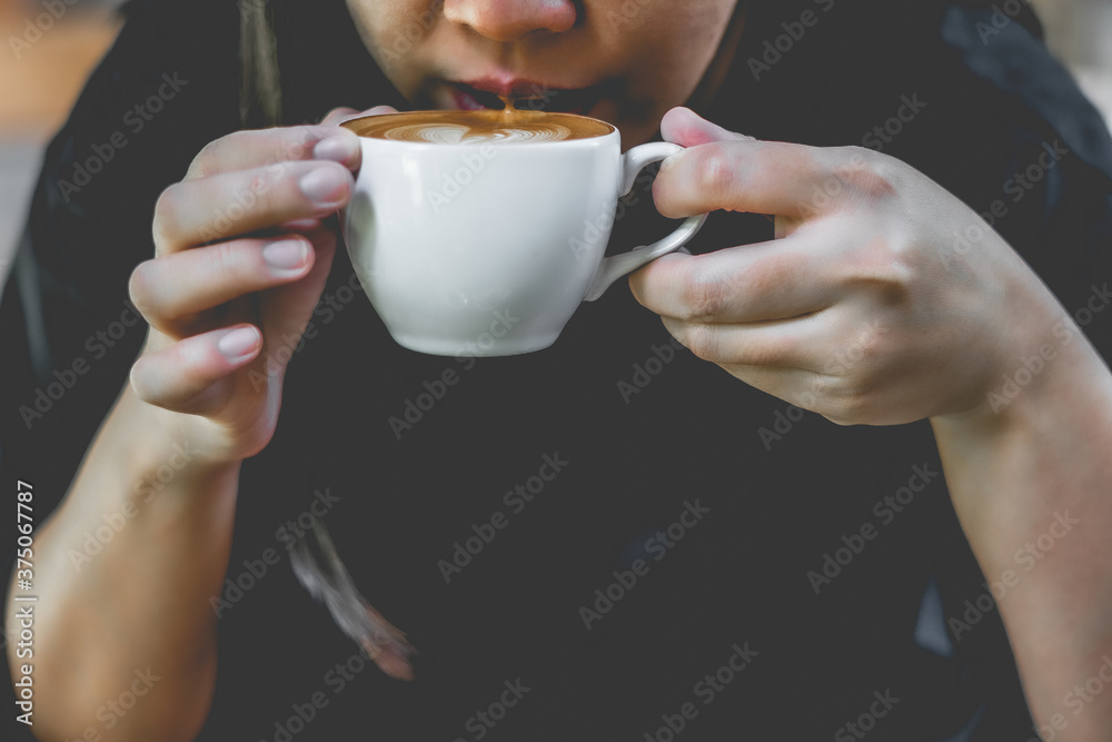 Closeup of coffee cups women enjoy coffee at a coffee shop Aerial view Closeup of coffee cups women enjoy coffee at a coffee shop Aerial view