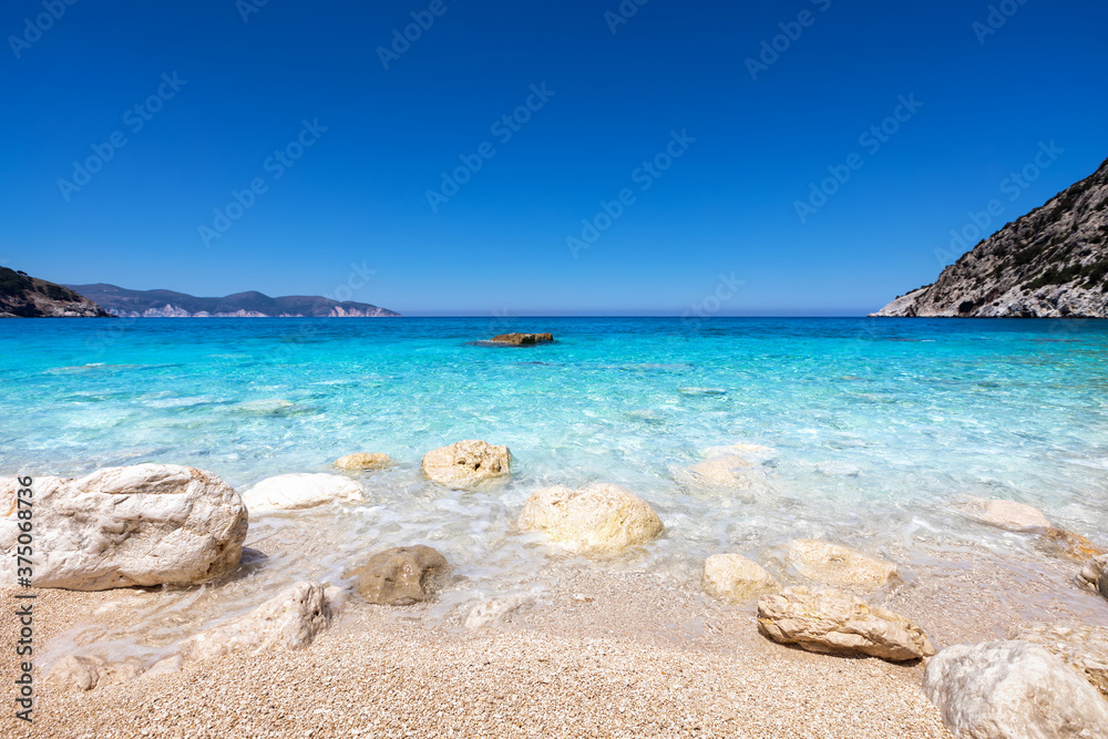 The clear, turquoise sea of the famous Myrtos beach on the Ionian island of Kefalonia, Greece