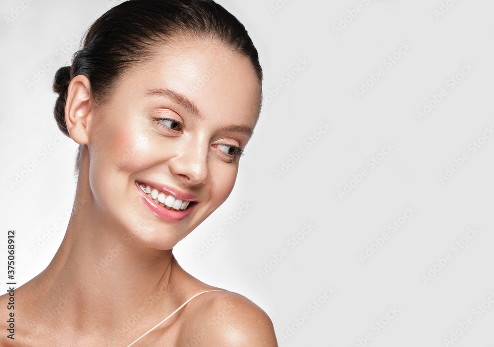 Beautiful young girl with a light natural make-up and perfect skin. Beauty face. Beautiful young girl with a light natural make-up and perfect skin. Beauty face.