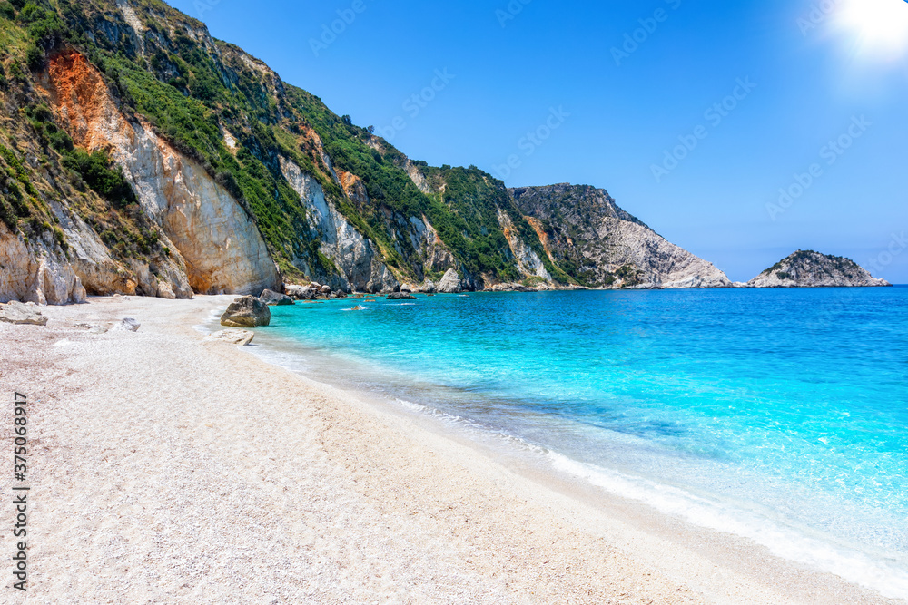 The beautiful Petani Beach at the west coast of Kefalonia with turquoise sea and fine pebble sand, Greece