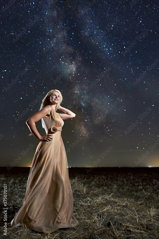 Woman in a dress under Milky Way Woman in a dress under Milky Way