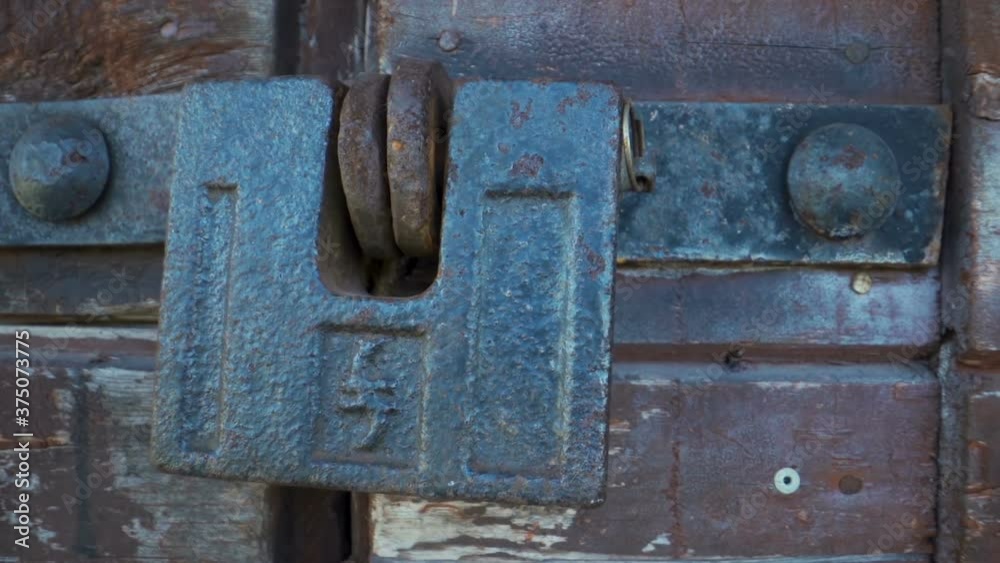 The metal door lock of the big wooden door The metal door lock of the big wooden door
