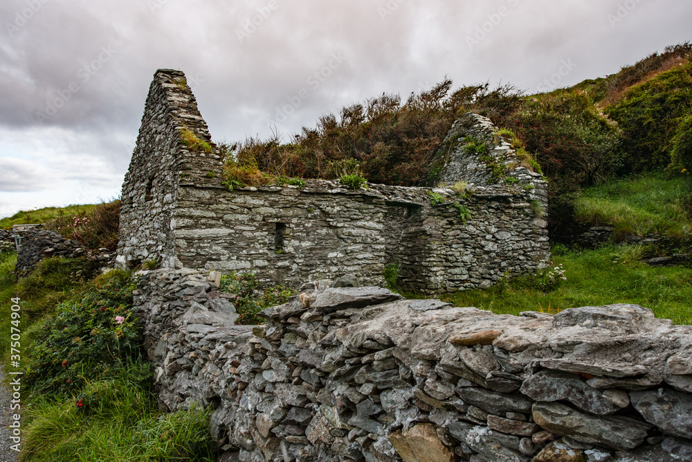 Old stone cottage ruins  in rural  west coast of Ireland.