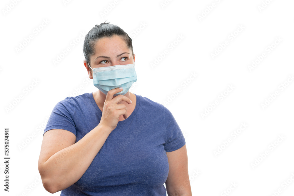 Woman thinking touching chin wearing mask with blank copyspace