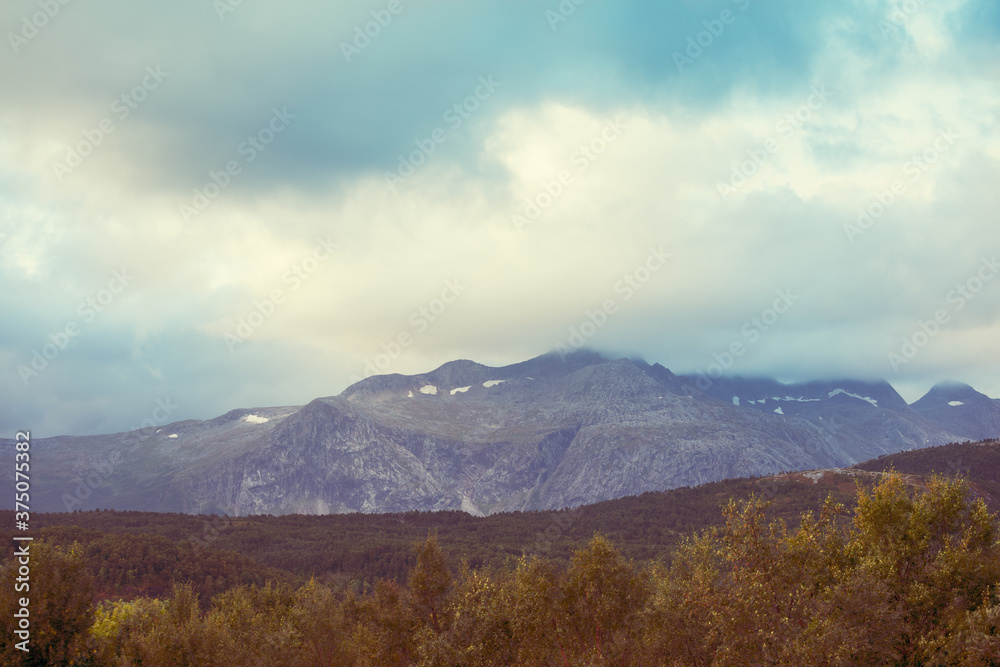 Mountain landscape. Mountain ridge in autumn. Nature of Norway Mountain landscape. Mountain ridge in autumn. Nature of Norway