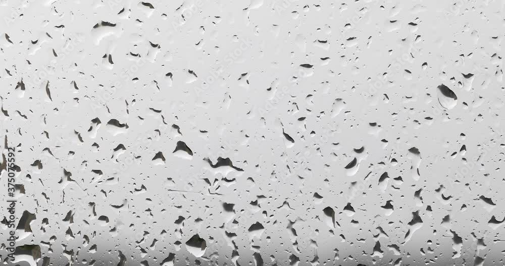 4k video of rain drops on window glass 4k video of rain drops on window glass