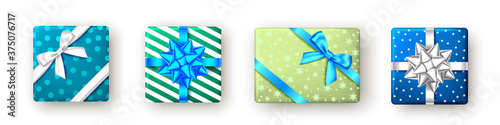 Blue, green gift box with ribbon and bow, top view.