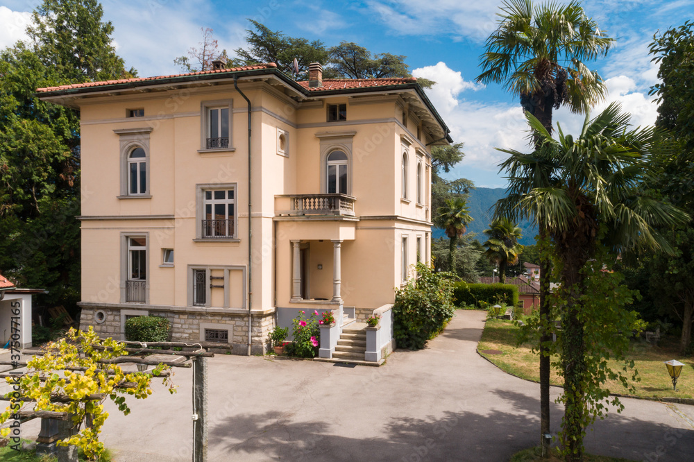 Ancient villa surrounded by nature in the hills in Switzerland. Sunny summer day Ancient villa surrounded by nature in the hills in Switzerland. Sunny summer day