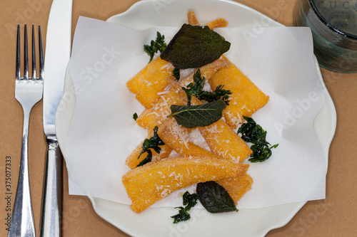 View of appetizer dish - fried polenta, served at Italian restaurant