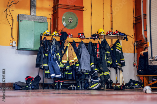 Picture of protective suits and helmets in fire brigade.