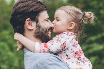 Happy Smiling Young Dad Playing With His Kid. Family Relationships Concept