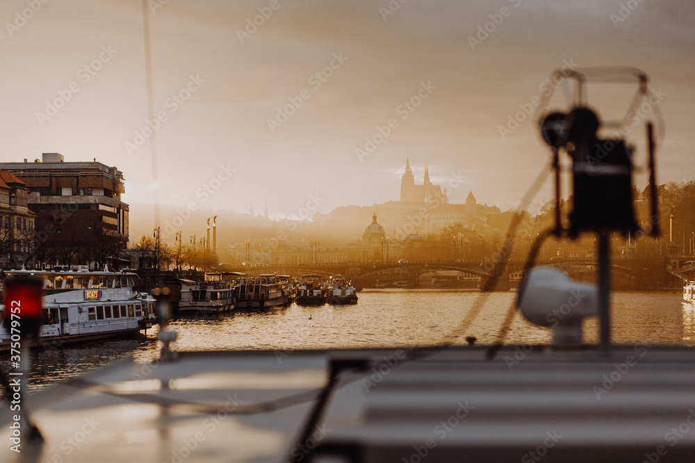 Naklejka premium Cityscape of Prague, Czech Republic from the upper deck of the cruise ship