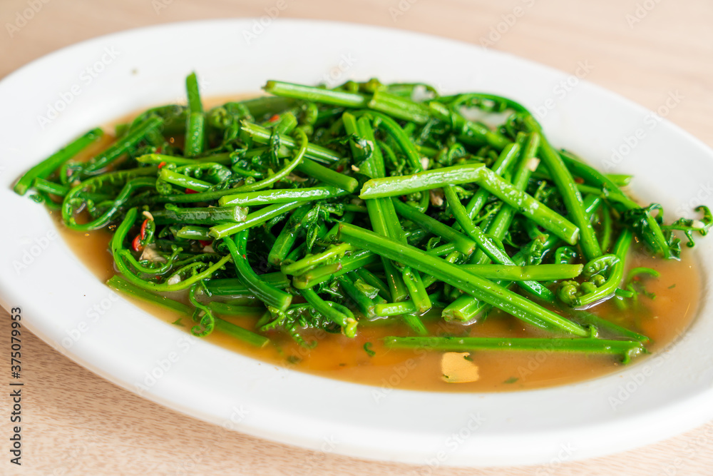 stir-fried vagatable fern with oyster sauce stir-fried vagatable fern with oyster sauce
