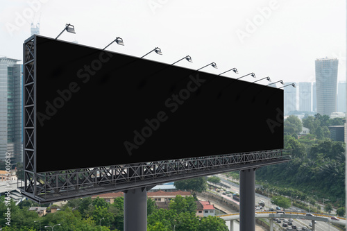 Canvas Print Blank black road billboard with Kuala Lumpur cityscape background at day time