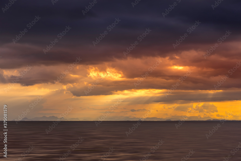 Seascape and clouds in rain season with sunlight.