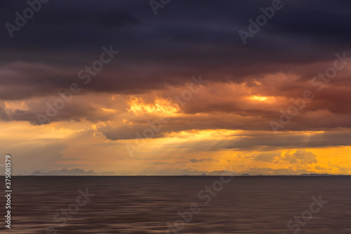 Seascape and clouds in rain season with sunlight.