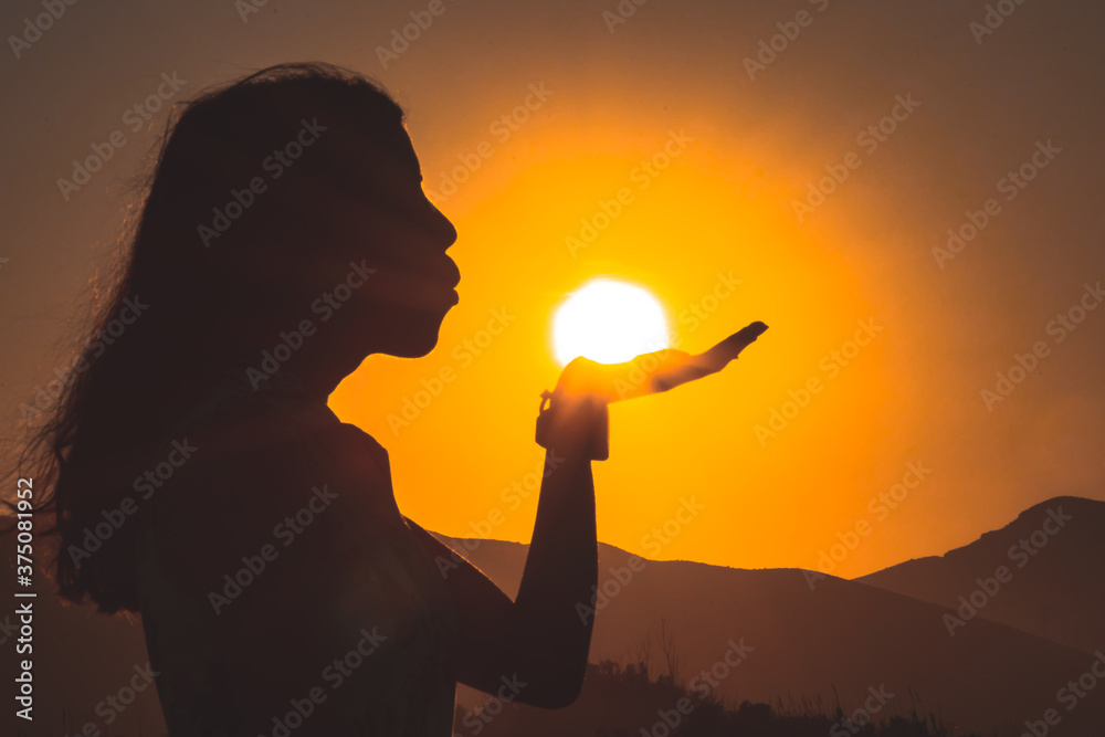 
Woman blowing in the sun