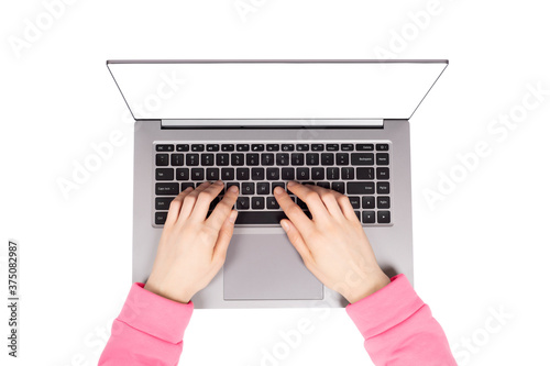 Female hands working on new laptop isolated on white background