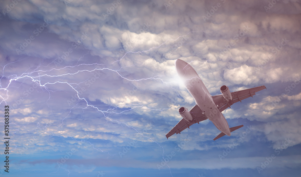 Fototapeta premium Airplane in the sky with thunder and lightning