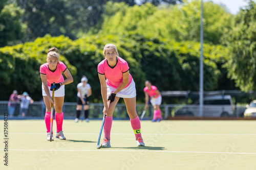Two field hockey players waiting for penalty shot