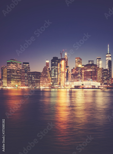 Manhattan waterfront at night  color toned picture  New York City  USA.