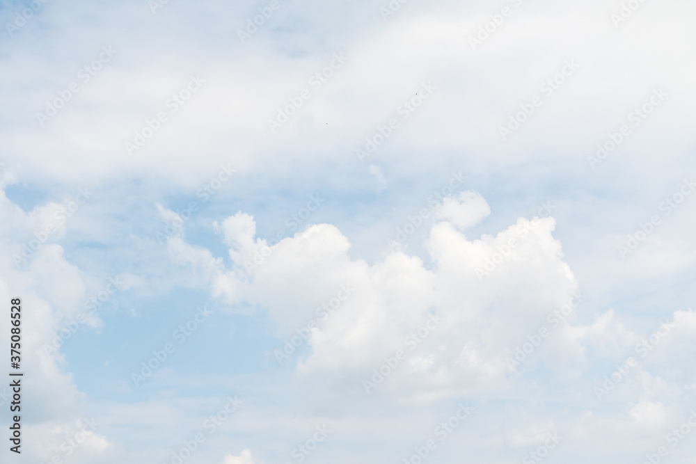 White fluffy clouds on a background of blue sky. White fluffy clouds on a background of blue sky.
