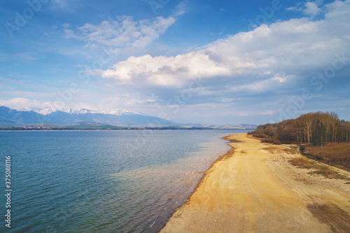 A beautiful lake surrounded by mountains in early spring. Liptov sea, Slovak Republic, Europe