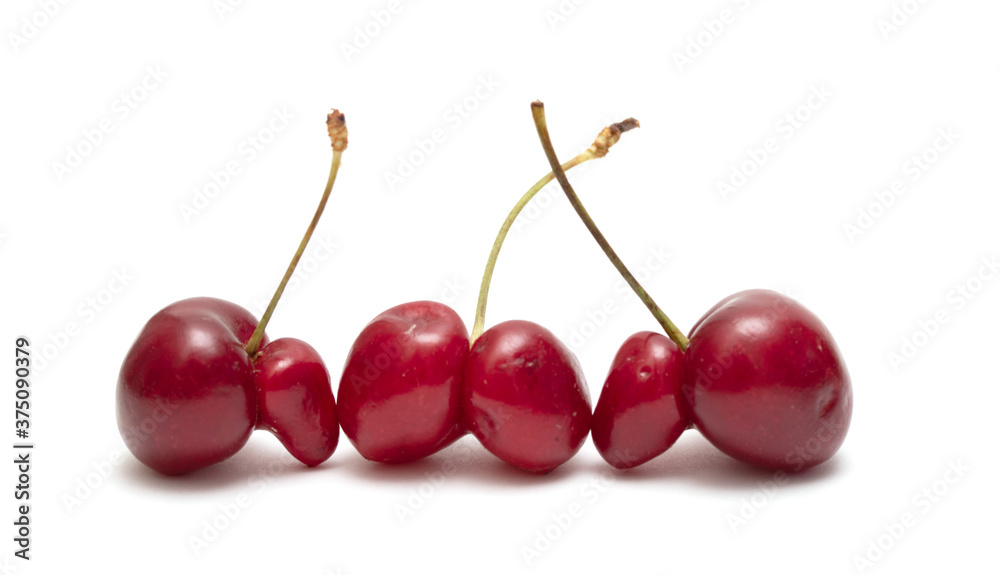 Ripe sweet cherry isolated on a white background, closeup. Ripe sweet cherry isolated on a white background, closeup.