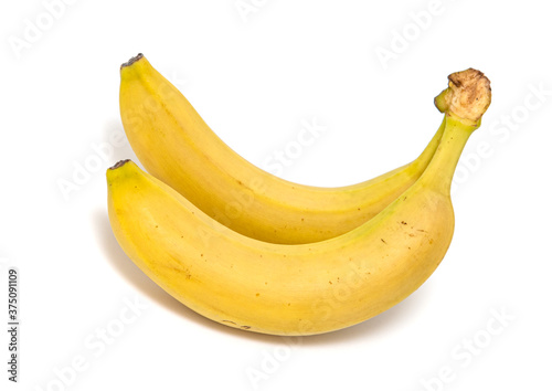 Two yellow ripe bananas isolated on a white background.