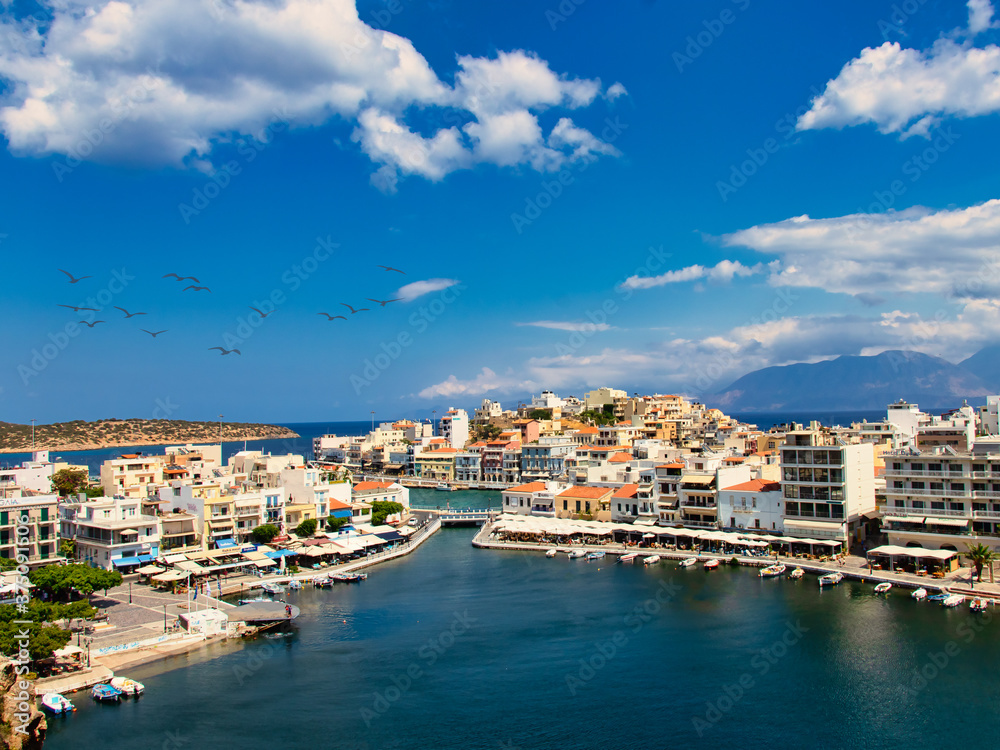 Agios Nikolaos, Greece - August 9, 2020 - View of the bay of Agios Nikolaos with the famous buildings