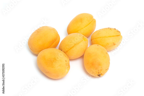Ripe apricots isolated on a white background.