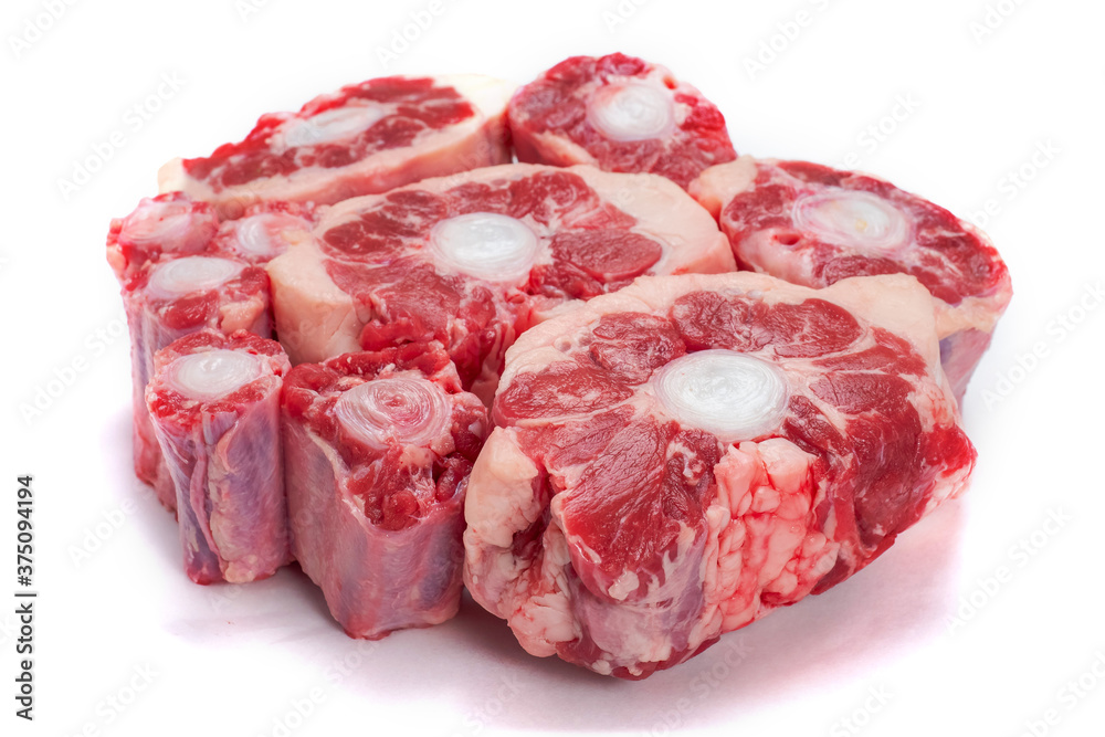 Pile of fresh raw ox tail portion on white background. Meat industry concept Pile of fresh raw ox tail portion on white background. Meat industry concept