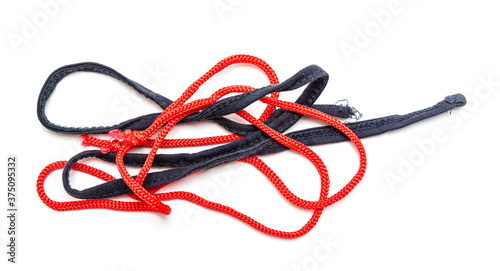 Rope with knots, rags on a white background.