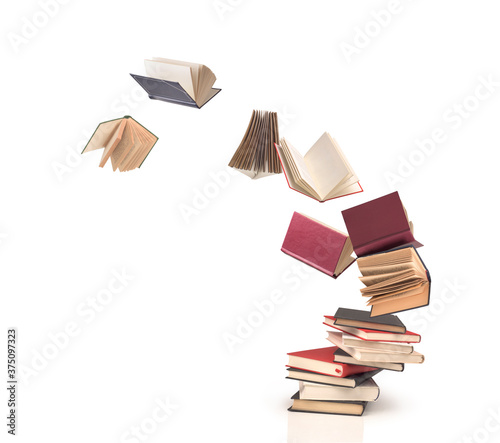 Obraz na płótnie flying open books out off stack isolated