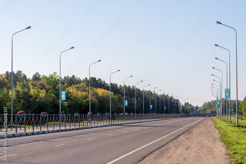 Autobahn, road in a summer forest, Kazakhstan.