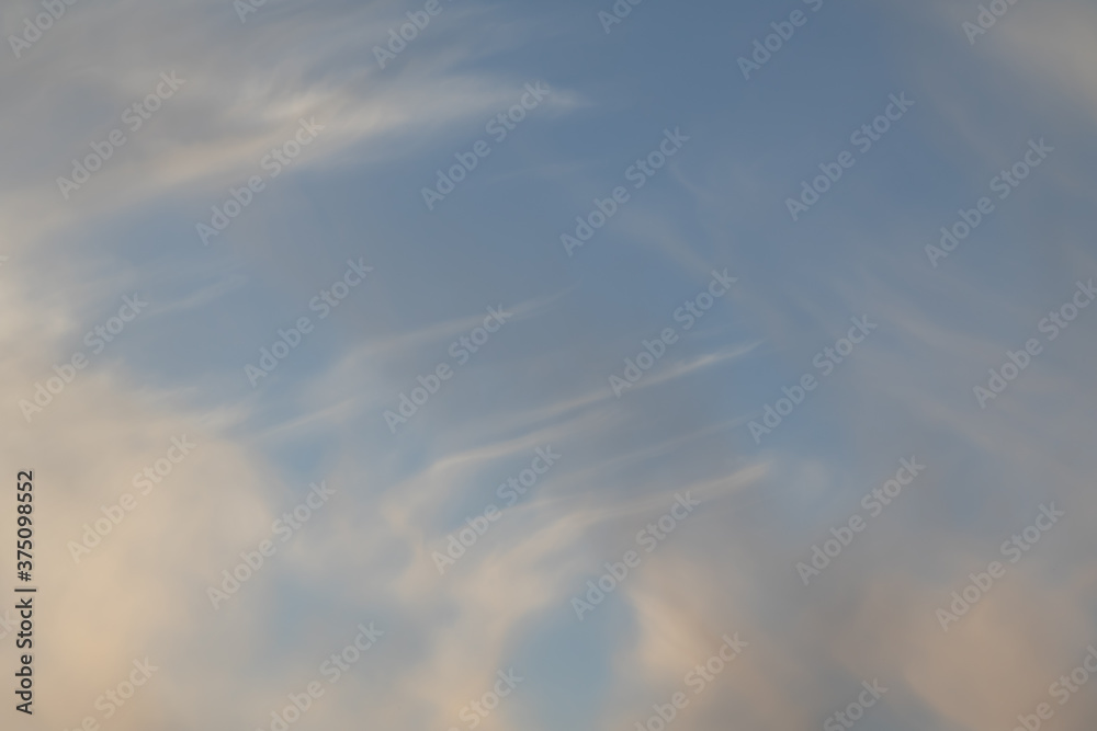 White cirrus clouds are filiform, the sky is blue. White cirrus clouds are filiform, the sky is blue.