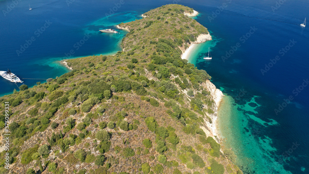Aerial drone photo of beautiful paradise beach of Skinos covered in pine trees in beautiful Ionian island of Ithaki or Ithaca, Greece