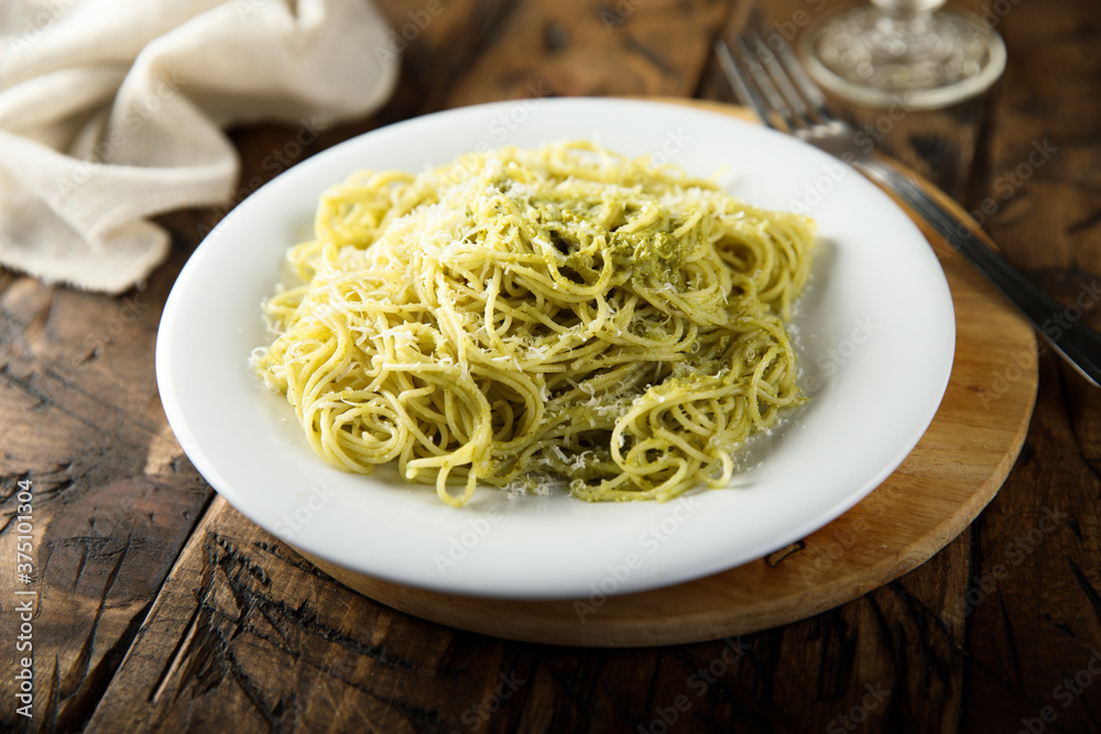 Spaghetti with pesto sauce and cheese Spaghetti with pesto sauce and cheese