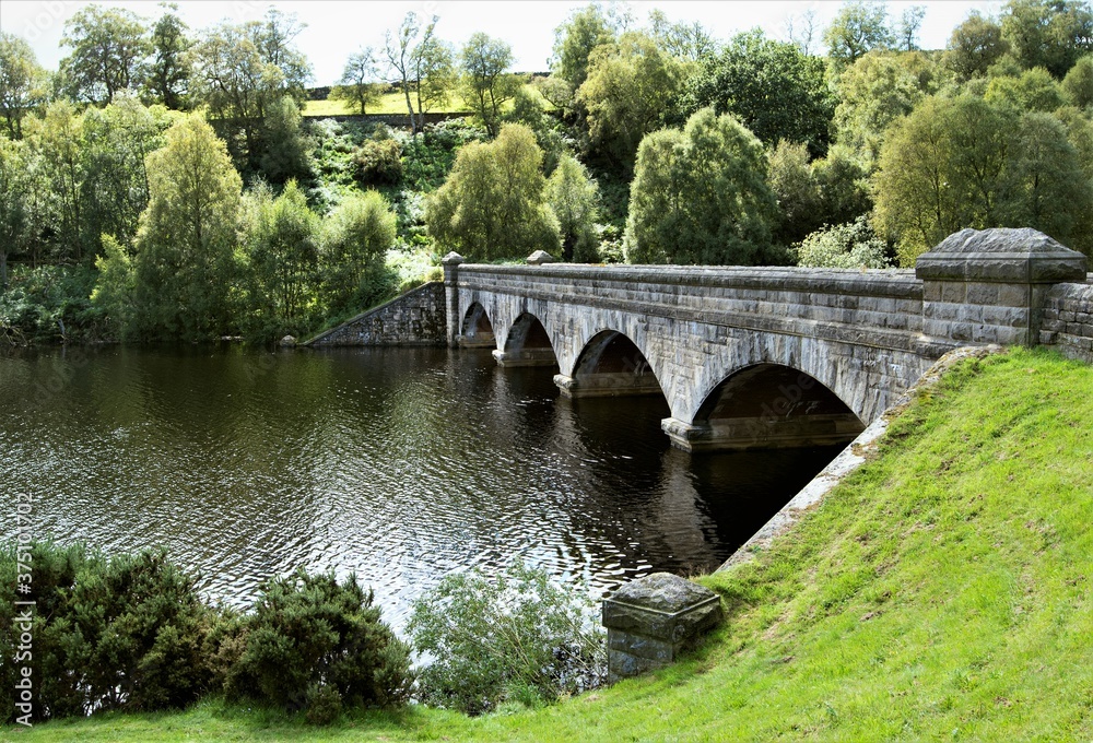 Fototapeta premium Bridge over Leighton Reservoir, Swinton, Ripon, North Yorkshire, England.