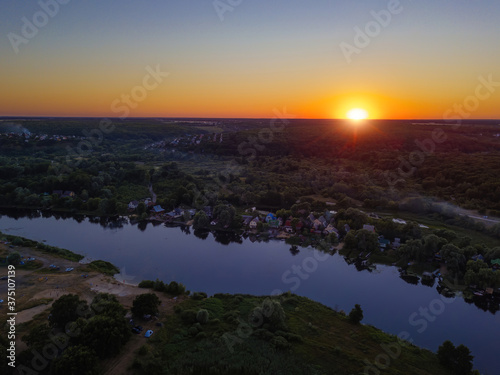 Sunset above the river in natural rural landscape