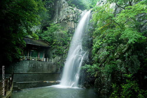 The beautiful temple background water fall.