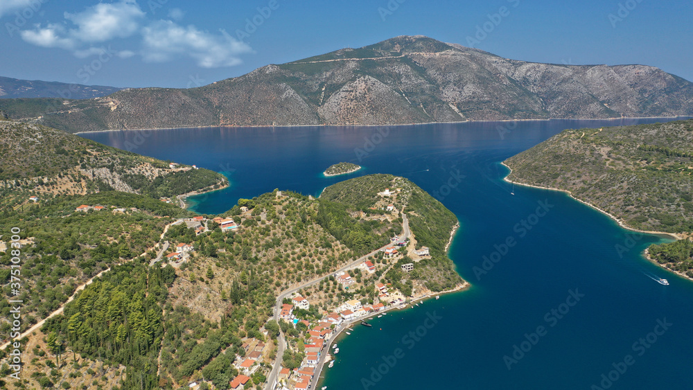 Aerial drone photo of picturesque village capital and port of Ithaki or Ithaca island a safe anchoring for sail boats featuring small islet of Lazareto with small chapel built on it, Ionian, Greece