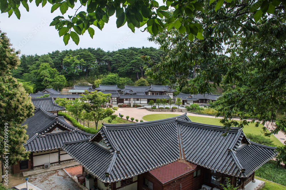 The beautiful traditional house, garden and forest at summer. The beautiful traditional house, garden and forest at summer.
