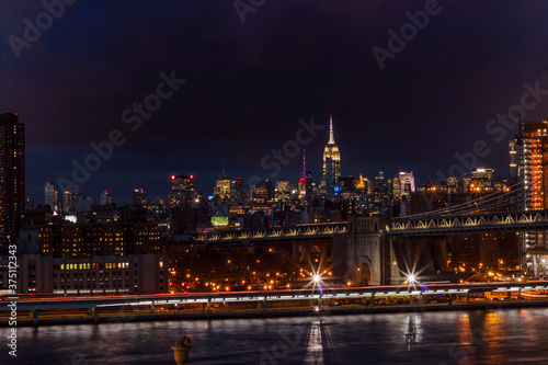 Night shot of New York skyline and the Brooklyn Bridge
