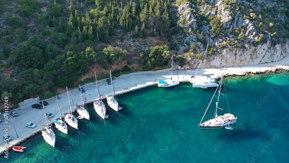 Aerial drone top down photo of sail boats anchored in small port of Frikes, Ithaki or Ithaca island, Ionian, Greece