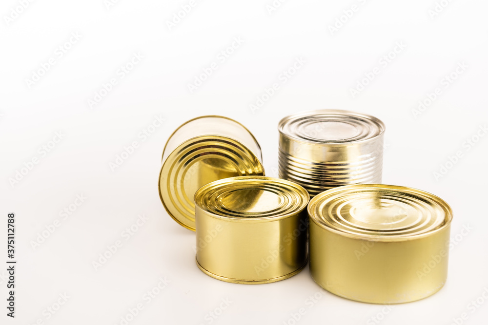 metal golden tins on white background metal golden tins on white background