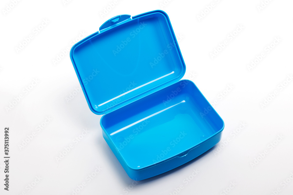 Open plastic lunch box on white background, food container for