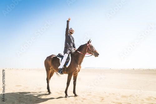 Arabian man with horse in the desert © oneinchpunch