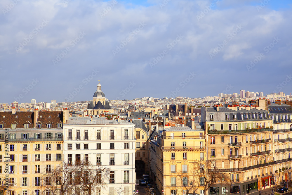 City view of street Quai de Bethune in Paris . Ile Saint Louis architecture . View of Paroisse Saint-Paul Saint-Louis church in Paris 
